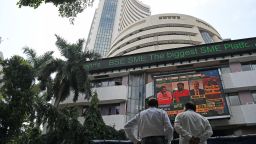 People are seen watching Sensex updates on the screen outside Bombay Stock Exchange (BSE) in Mumbai, India, on September 24, 2021.