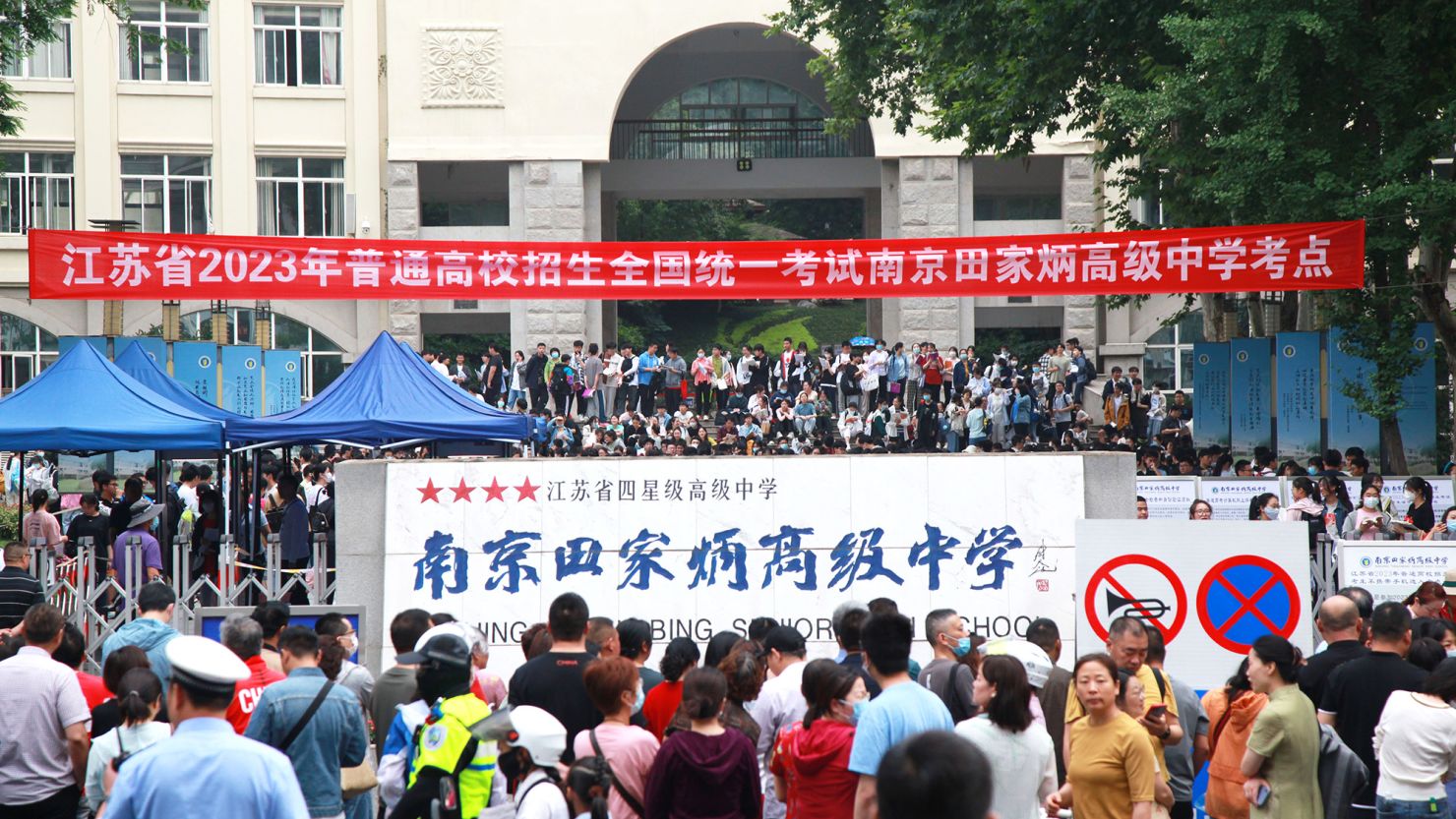 Candidates wait to enter a college entrance exam site in Nanjing, China, on June 7, 2023.
