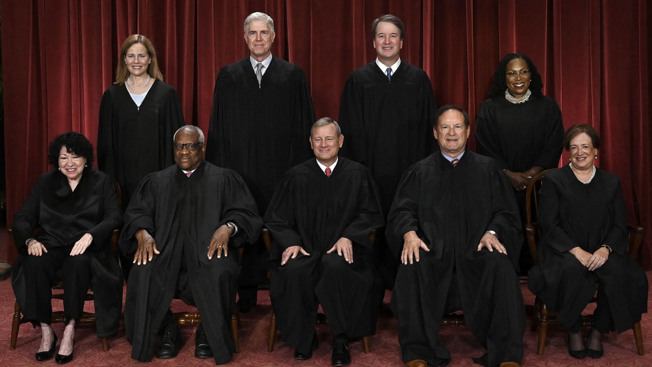 TOPSHOT - Justices of the US Supreme Court pose for their official photo at the Supreme Court in Washington, DC on October 7, 2022. - (Seated from left) Associate Justice Sonia Sotomayor, Associate Justice Clarence Thomas, Chief Justice John Roberts, Associate Justice Samuel Alito and Associate Justice Elena Kagan, (Standing behind from left) Associate Justice Amy Coney Barrett, Associate Justice Neil Gorsuch, Associate Justice Brett Kavanaugh and Associate Justice Ketanji Brown Jackson. (Photo by OLIVIER DOULIERY / AFP) (Photo by OLIVIER DOULIERY/AFP via Getty Images)