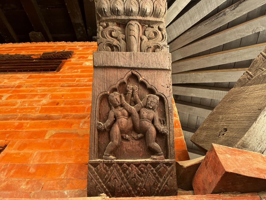 Two male figures engage in a sexual act in this carving at a Kathmandu temple