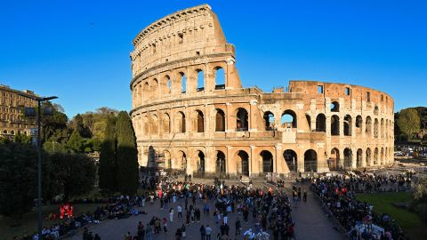 A general view shows people gathering at the Colosseum monument in Rome on April 7, 2023, prior to the Way of the Cross (Via Crucis) prayer service as part of celebrations of the Holy Week. - Pope Francis, who is recovering from bronchitis and last week spent three nights in hospital, will not attend the traditional "Way of the Cross" prayer service on Good Friday, the Vatican said. (Photo by Andreas SOLARO / AFP) (Photo by ANDREAS SOLARO/AFP via Getty Images)