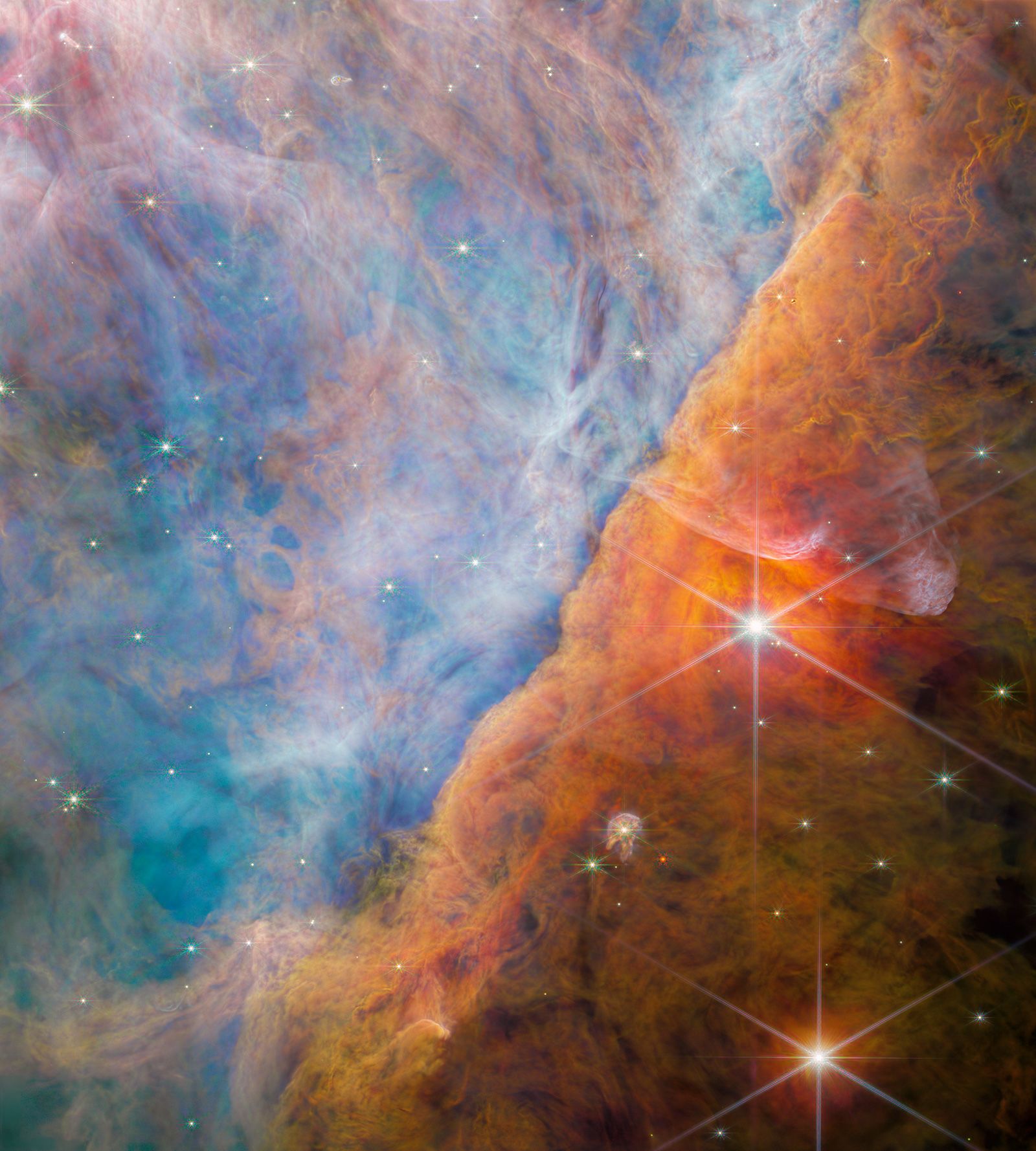 The James Webb Space Telescope captured the Orion Bar, a part of the Orion Nebula that is being eroded by stellar radiation emanating from the Trapezium Cluster.