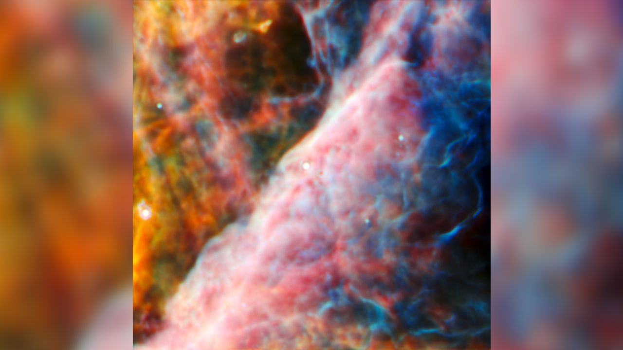 This image from Webb's MIRI (Mid-Infrared Instrument) shows a small region of the Orion Nebula. At the center of this view is a young star system with a protoplanetary disk named d203-506. An international team of astronomers detected a new carbon molecule known as methyl cation for the first time in d203-506.