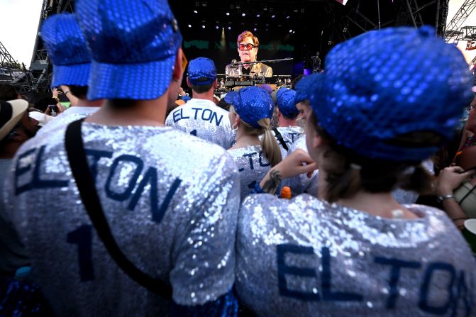 Fans watch Elton John perform on stage during the Glastonbury Festival in Glastonbury, England on June 25. The artist has said this will be his last ever live show in the UK. 