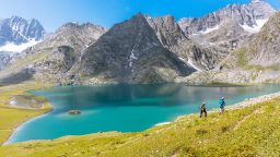 Sonamarg,India - August 15 2017 : Trekkers Hike along the beautiful Kishansar lake on the Kashmir Great Lakes trek in Sonamarg, India. Most serene trek in the Himalayas with glacial lakes & valleys