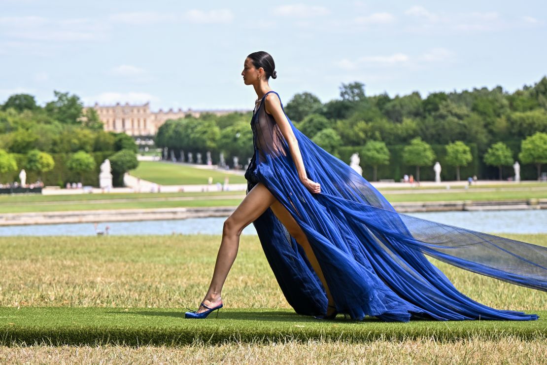 VERSAILLES, FRANCE - JUNE 26: A model walks the runway during "Le Chouchou" Jacquemus' Fashion Show at Chateau de Versailles on June 26, 2023 in Versailles, France. (Photo by Stephane Cardinale - Corbis/Corbis via Getty Images)