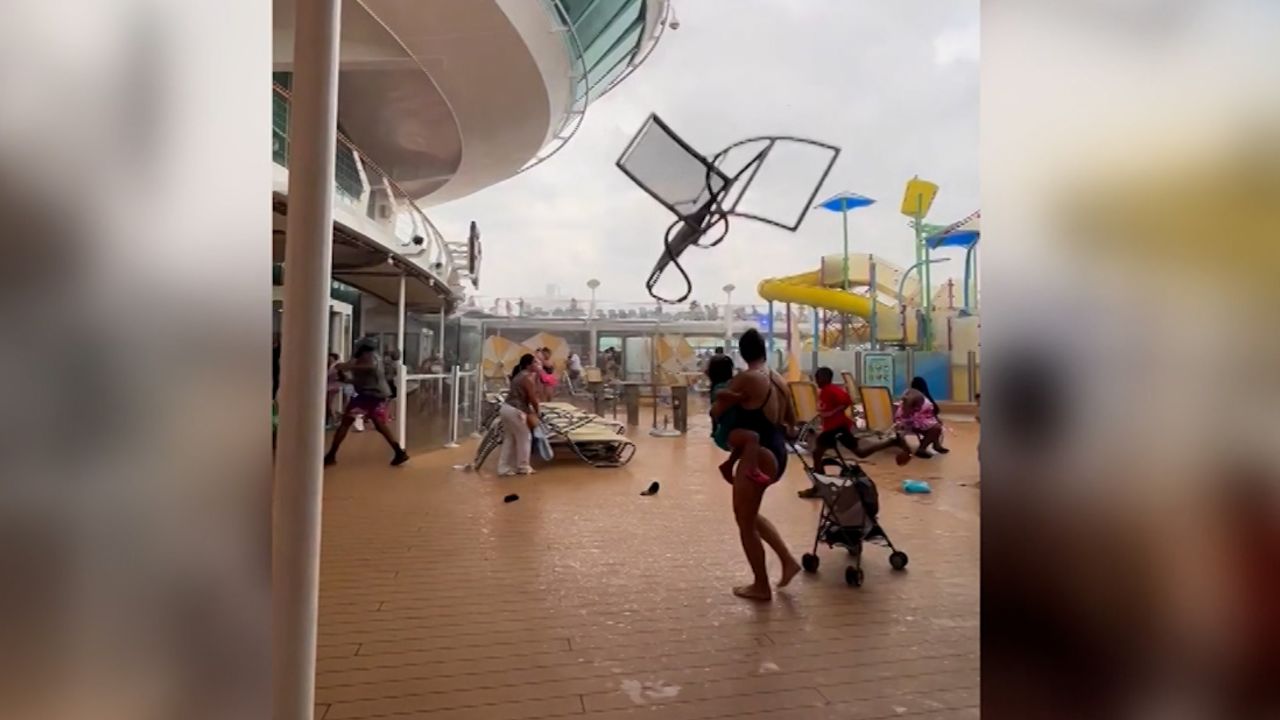 Watch cruise passengers flee flying lounge chairs, debris as storm hits |  CNN