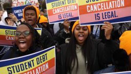 Demonstrators outside the Supreme Court, which is hearing two cases Tuesday about student debt, in Washington, Feb. 28, 2023.