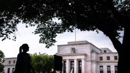 A pedestrian passes the Marriner S. Eccles Federal Reserve building in Washington, DC, US, on Saturday, June 3, 2023. 