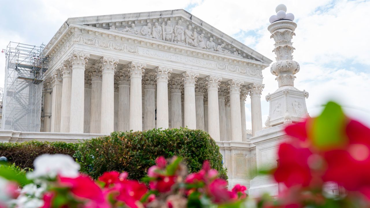 The Supreme Court is seen behind flowers, Tuesday, June 27, 2023, in Washington, as decisions are expected.