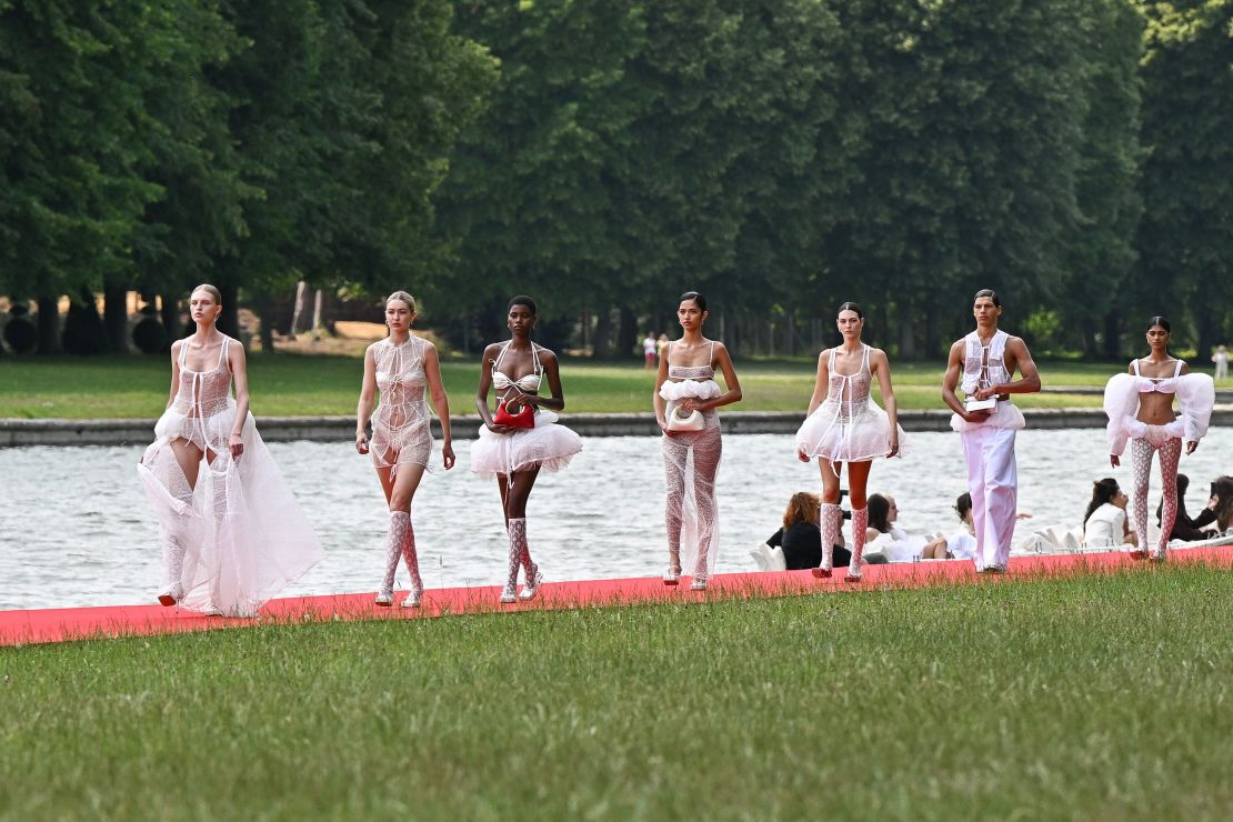 VERSAILLES, FRANCE - JUNE 26: Models and Gigi Hadid (2L) walk the runway during "Le Chouchou" Jacquemus' Fashion Show at Chateau de Versailles on June 26, 2023 in Versailles, France. (Photo by Stephane Cardinale - Corbis/Corbis via Getty Images)