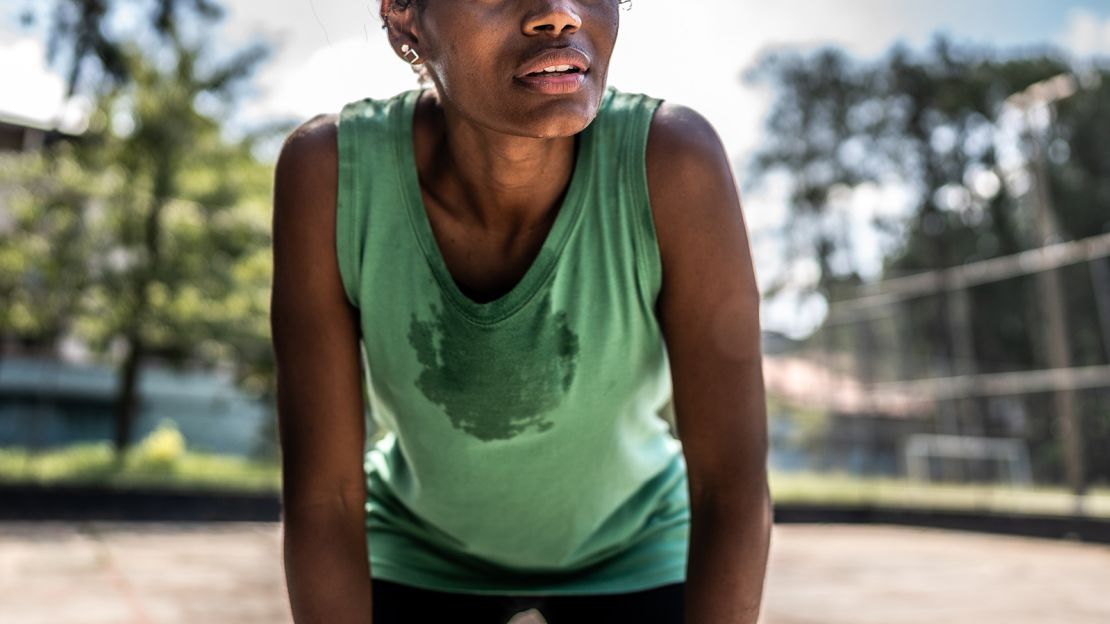 Tired young woman in a sports court