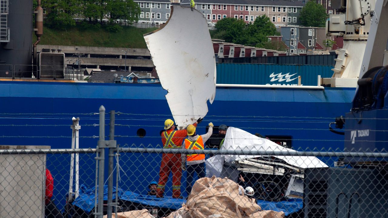 Debris from the Titan submersible recovered from the ocean floor near the wreck of the Titanic is unloaded Wednesday in Newfoundland.