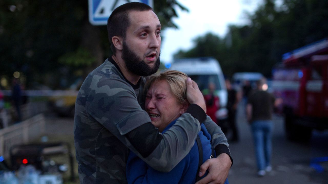 People comfort each other at the site of a Russian missile strike in Kramatorsk on June 27.