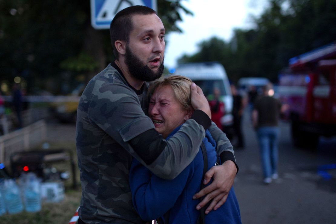 People comfort each other at the site of a Russian missile strike in Kramatorsk on June 27.