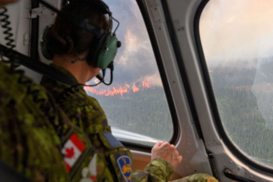 A Canadian soldier flies over a wildfire near Mistissini, Quebec, on June 12.