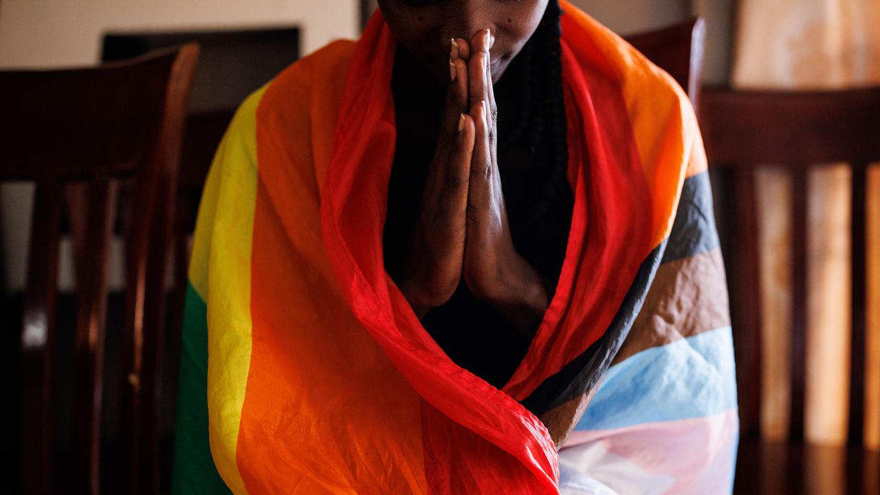A member of the LGBTQ community prays during an evangelical church service on April 23, 2023 in Kampala, Uganda.