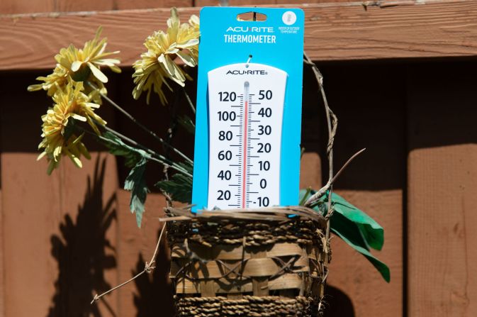 A backyard thermometer shows triple-digit temperatures in Plano, Texas, on Tuesday, June 27.