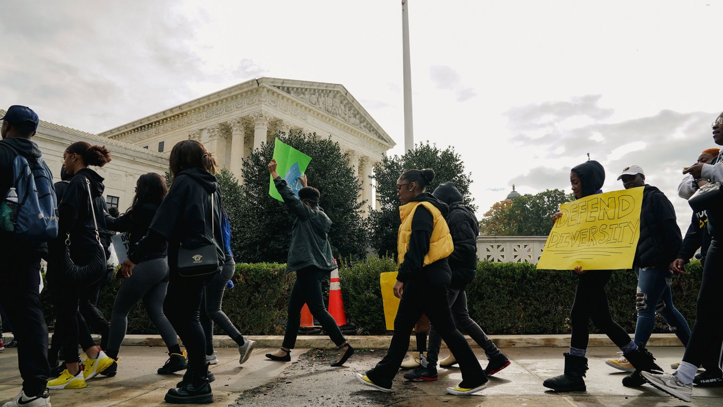 Activists rally outside the Supreme Court in Washington on Monday, Oct. 31, 2022, as the justices hear oral arguments in the affirmative action cases involving Harvard and the University of North Carolina at Chapel Hill. 