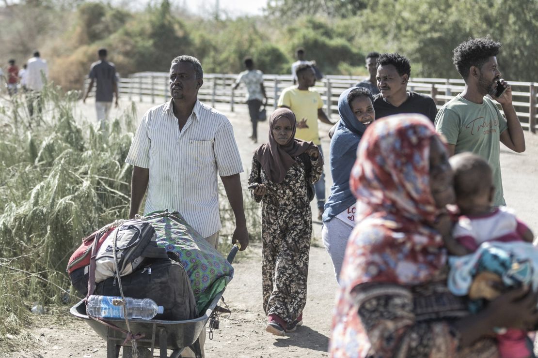 Refugees from Sudan cross into Ethiopia. 