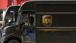 A UPS delivery driver sits in traffic with his truck door open while driving through Times Square, New York, NY, June 15, 2023. A tentative deal has been reached between Teamsters union and UPS to install air conditionig systems in its delivery trucks just in time before summer temperatures arrive. (Photo by Anthony Behar/Sipa USA)(Sipa via AP Images)