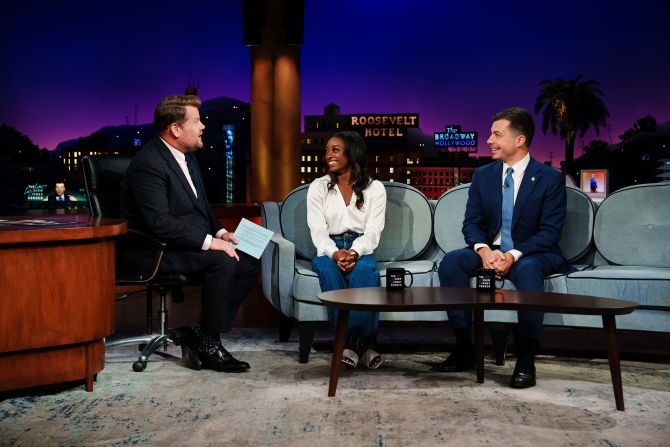 Biles appears on "The Late Late Show with James Corden" in September 2022. On the right is US Transportation Secretary Pete Buttigieg.