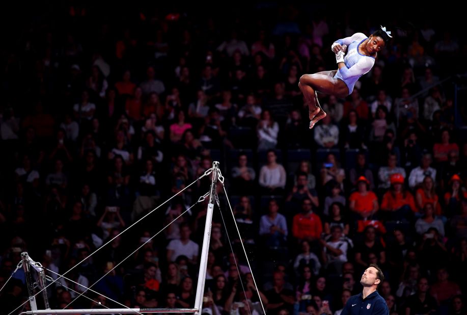 Biles soars through the air while competing on the uneven bars at the World Championships in 2019. Again, she won gold in the individual all-around.