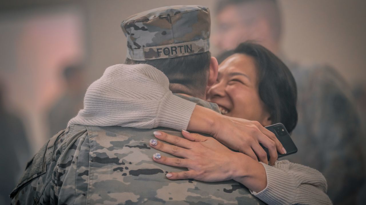 US Army air defenders with Bravo Battery, 5th Battalion, 7th Air Defense Artillery Regiment, 10th Army Air Missile Defense Command, reunite with family and friends after a year-long deployment