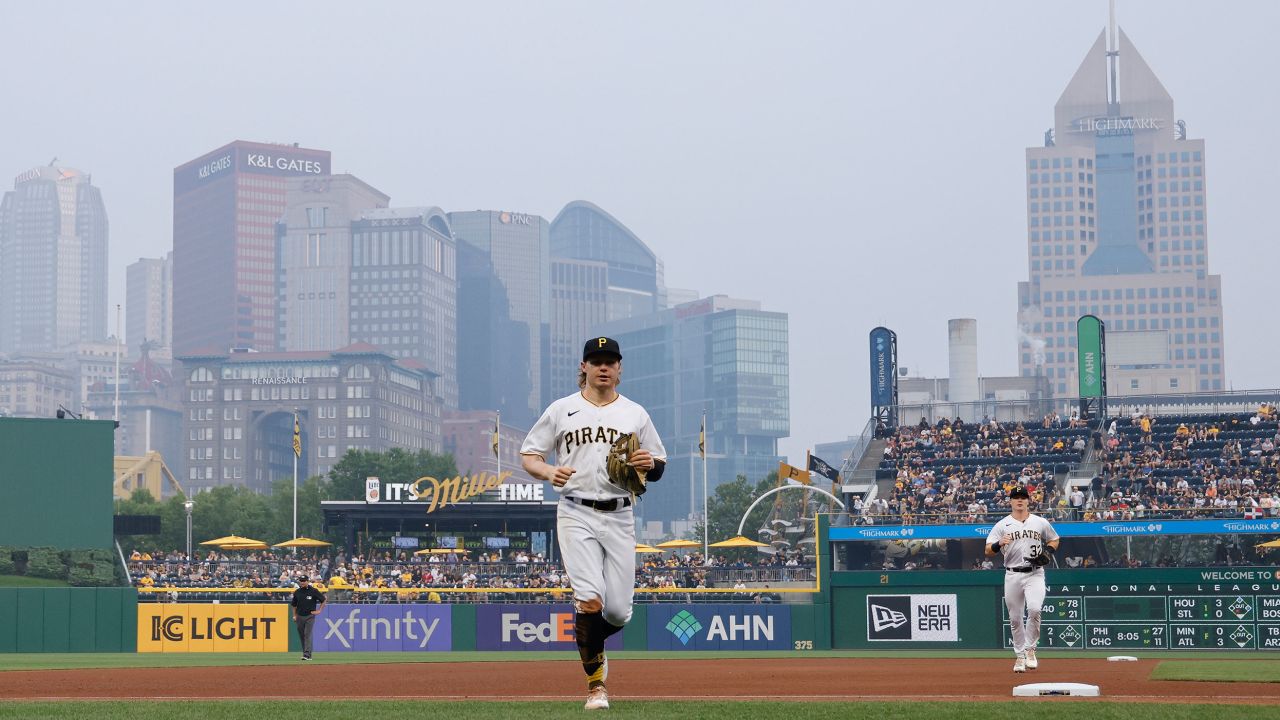 Pittsburgh Pirates play as smoke from wildfires in Canada descends on the downtown skyline in Pittsburgh on Wednesday.