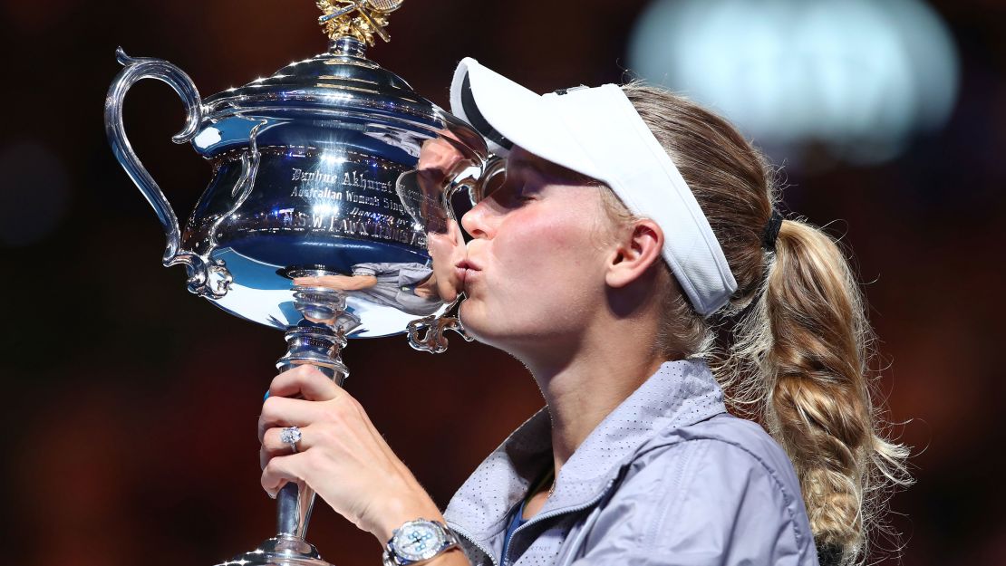 MELBOURNE, AUSTRALIA - JANUARY 27:  Caroline Wozniacki of Denmark poses for a photo with the Daphne Akhurst Memorial Cup after winning the women's singles final against Simona Halep of Romania on day 13 of the 2018 Australian Open at Melbourne Park on January 27, 2018 in Melbourne, Australia.  (Photo by Clive Brunskill/Getty Images)