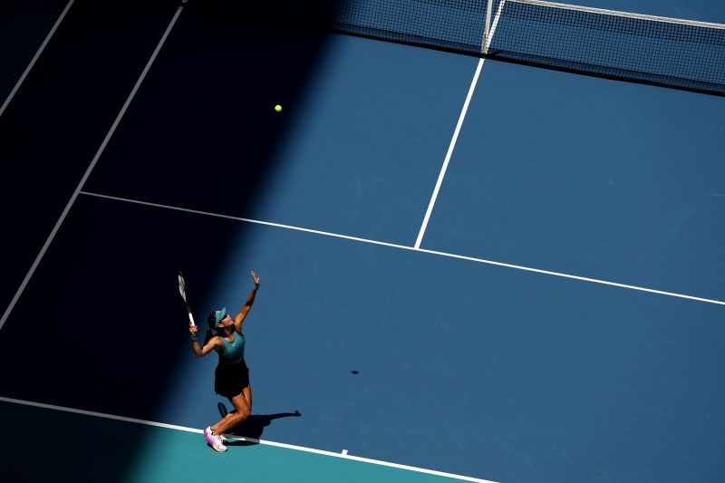 MIAMI GARDENS, FLORIDA - MARCH 22: Emma Raducanu of Great Britain serves against Bianca Andreescu of Canada in their first round match during the Miami Open at Hard Rock Stadium  on March 22, 2023 in Miami Gardens, Florida. (Photo by Clive Brunskill/Getty Images)