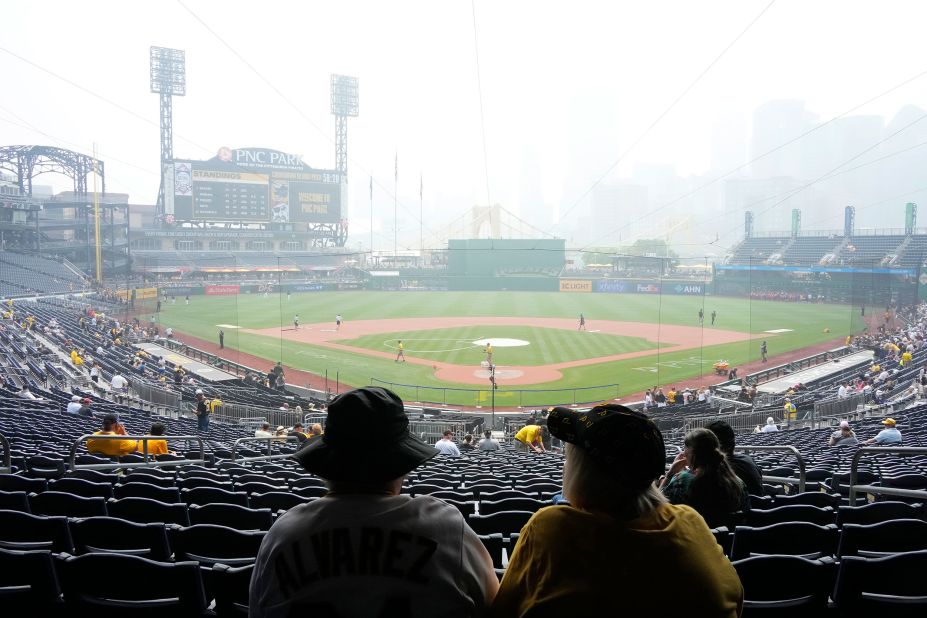 Haze hangs over downtown Pittsburgh and PNC Park as fans take their seats before a Major League Baseball game between the Pittsburgh Pirates and the San Diego Padres on June 29.