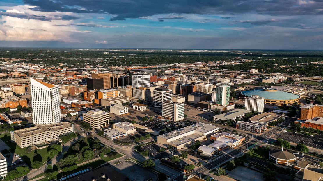 Drone aerial view of downtown Wichita Skyline features Arkansas Rivers and bridges, Kansas.