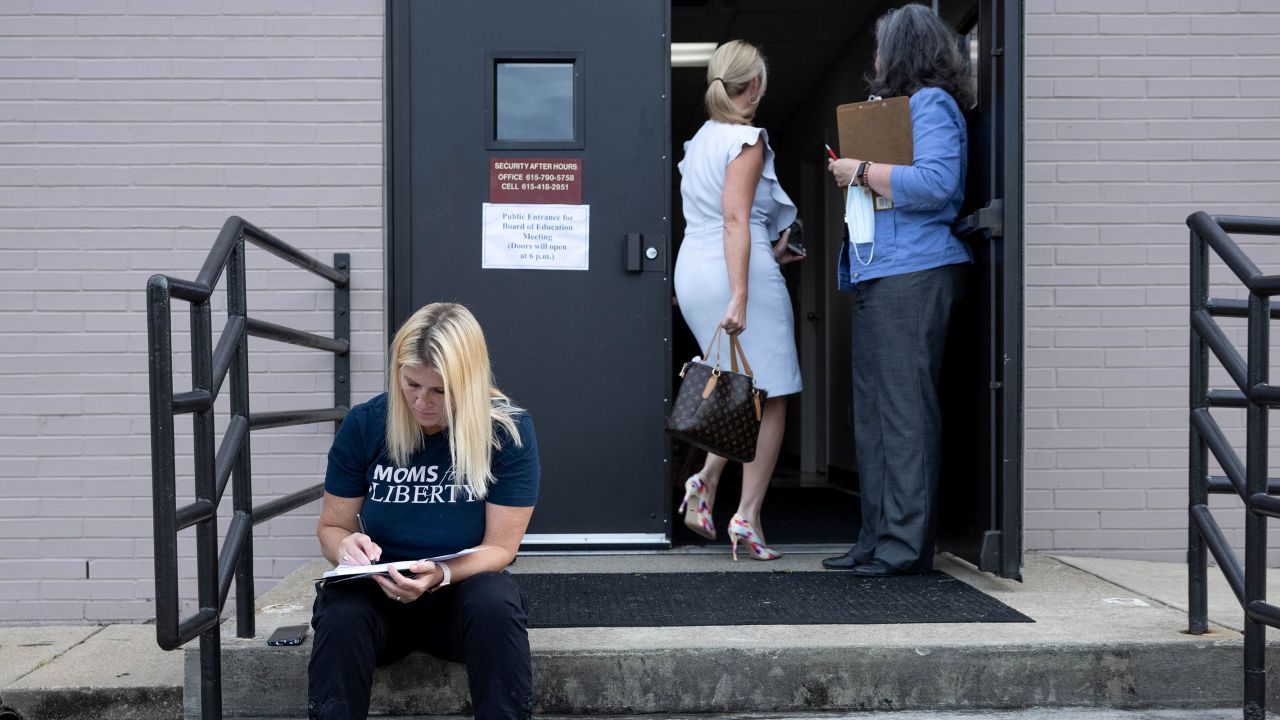 In this August 2021 photo, Robin Steenman, chair of her local chapter of Moms for Liberty, prepares her public comment before entering the local board of education meeting, in Franklin, Tennessee.