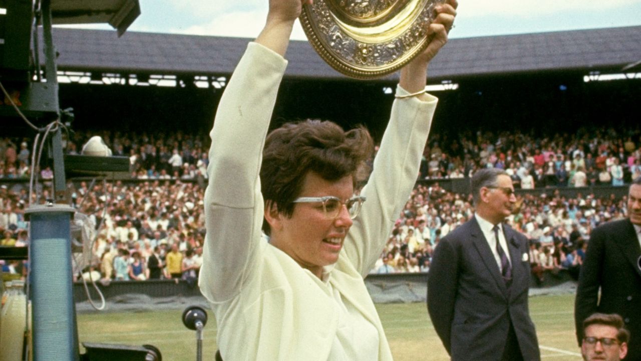Jun-Jul 1966:  Billie Jean King of the USA holds the trophy aloft after her victory in the Women's Singles event at the Lawn Tennis Championships at Wimbledon in London.    \ Mandatory Credit: Allsport UK /Allsport