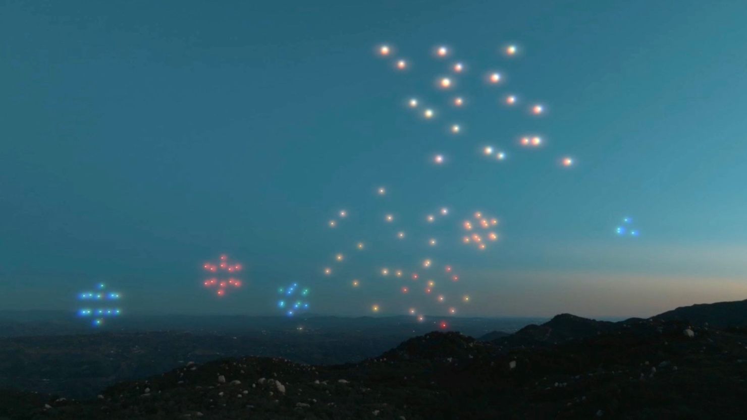 A light show from Drone Studios shows the aerial decorations displayed by the machines' colorful pixels.