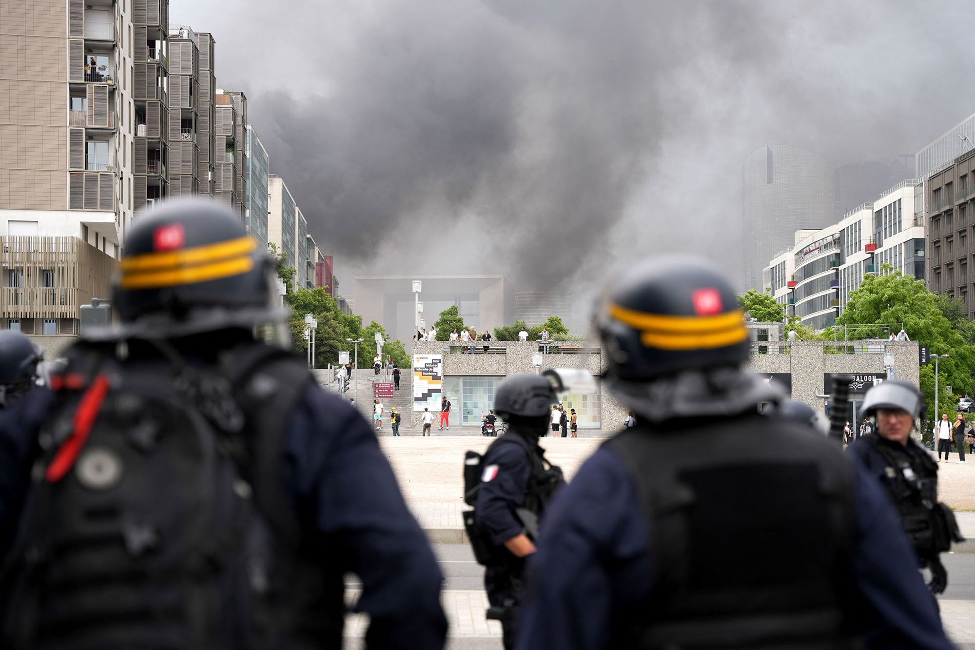 Police face protesters at the end of a march in Paris on June 29.