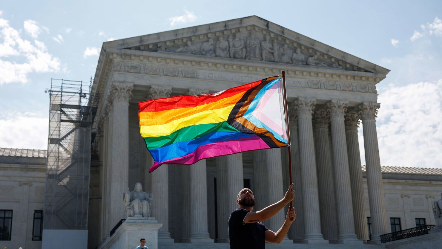 Same-sex marriage supporter Vin Testa waves a pride flag in front of the US Supreme Court Building on June 26, 2023 in Washington.