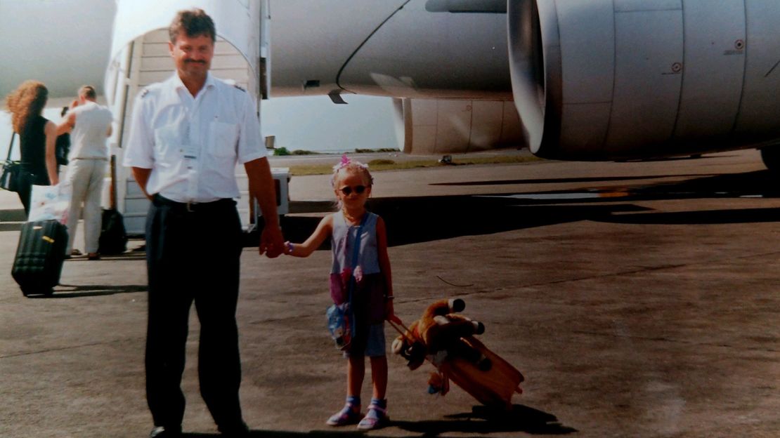 Here's a young Fila pictured with her pilot father. She says she loved air travel from an early age.