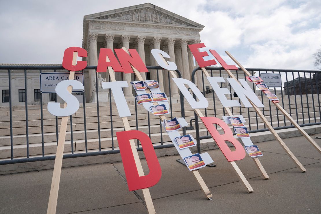 A sign calling for student loan debt relief is seen in front of the Supreme Court as the justices are scheduled to hear oral arguments in two cases involving President Joe Biden's bid to reinstate his plan to cancel billions of dollars in student debt in Washington, U.S., February 28, 2023.