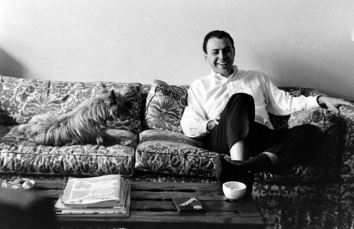 Arkin and a dog sit on a couch together in 1966. Arkin won a Tony Award for his Broadway debut in the 1963 play "Enter Laughing."