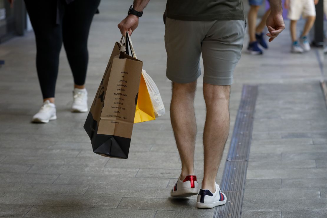 A shopper carries retail bags in Miami, Florida, on Wednesday, June 14, 2023. 
