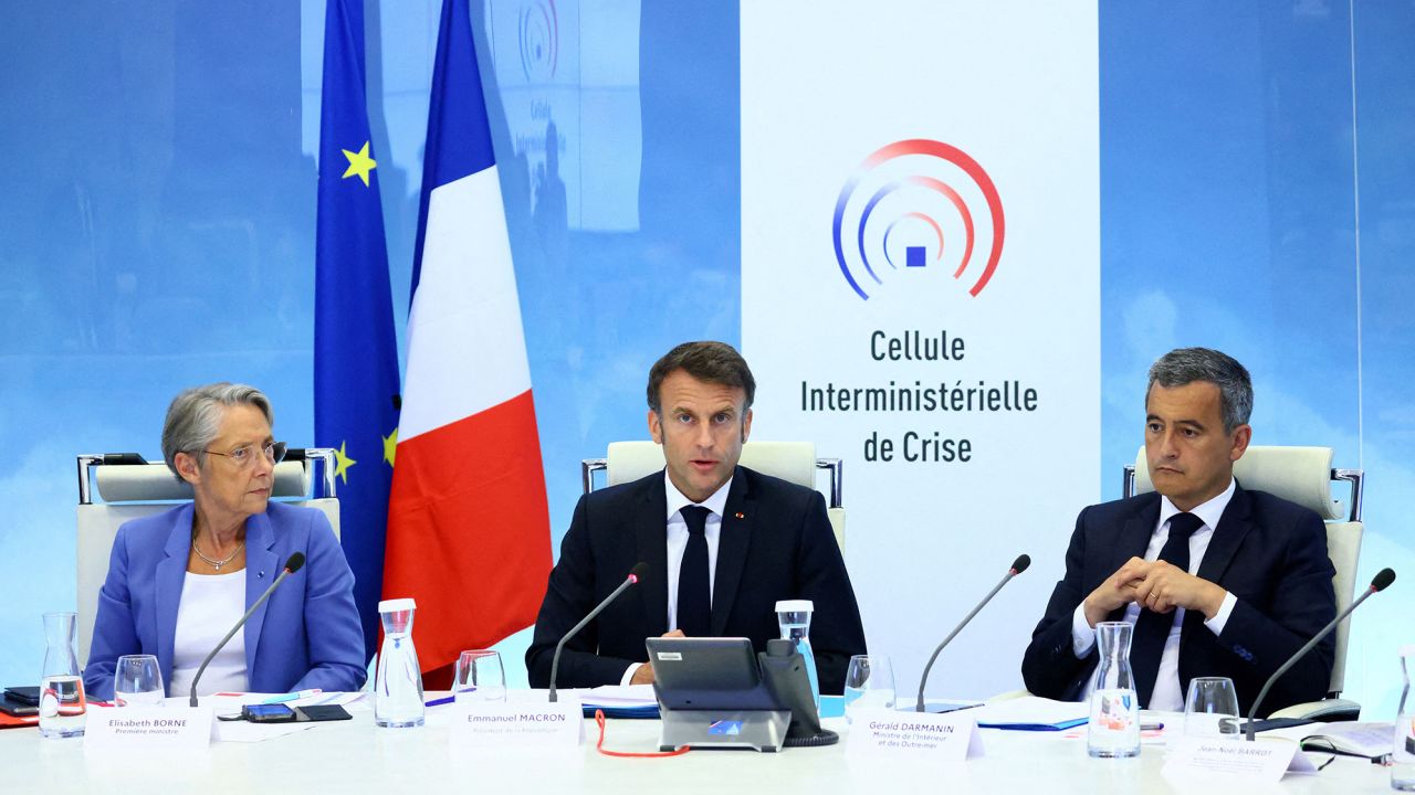 French President Emmanuel Macron (center) held a crisis meeting, in Paris, on Friday, after the police shooting of a teenage boy triggered protests.