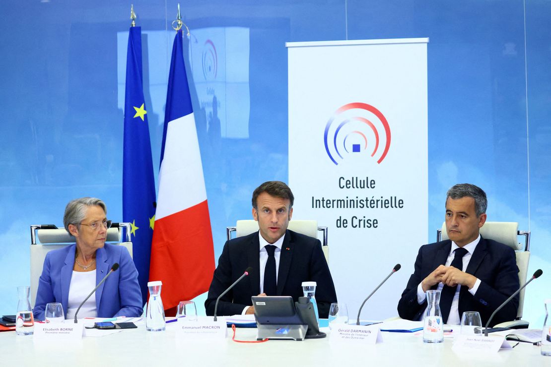 French President Emmanuel Macron (center) held a crisis meeting, in Paris, on Friday, after the police shooting of a teenage boy triggered protests.