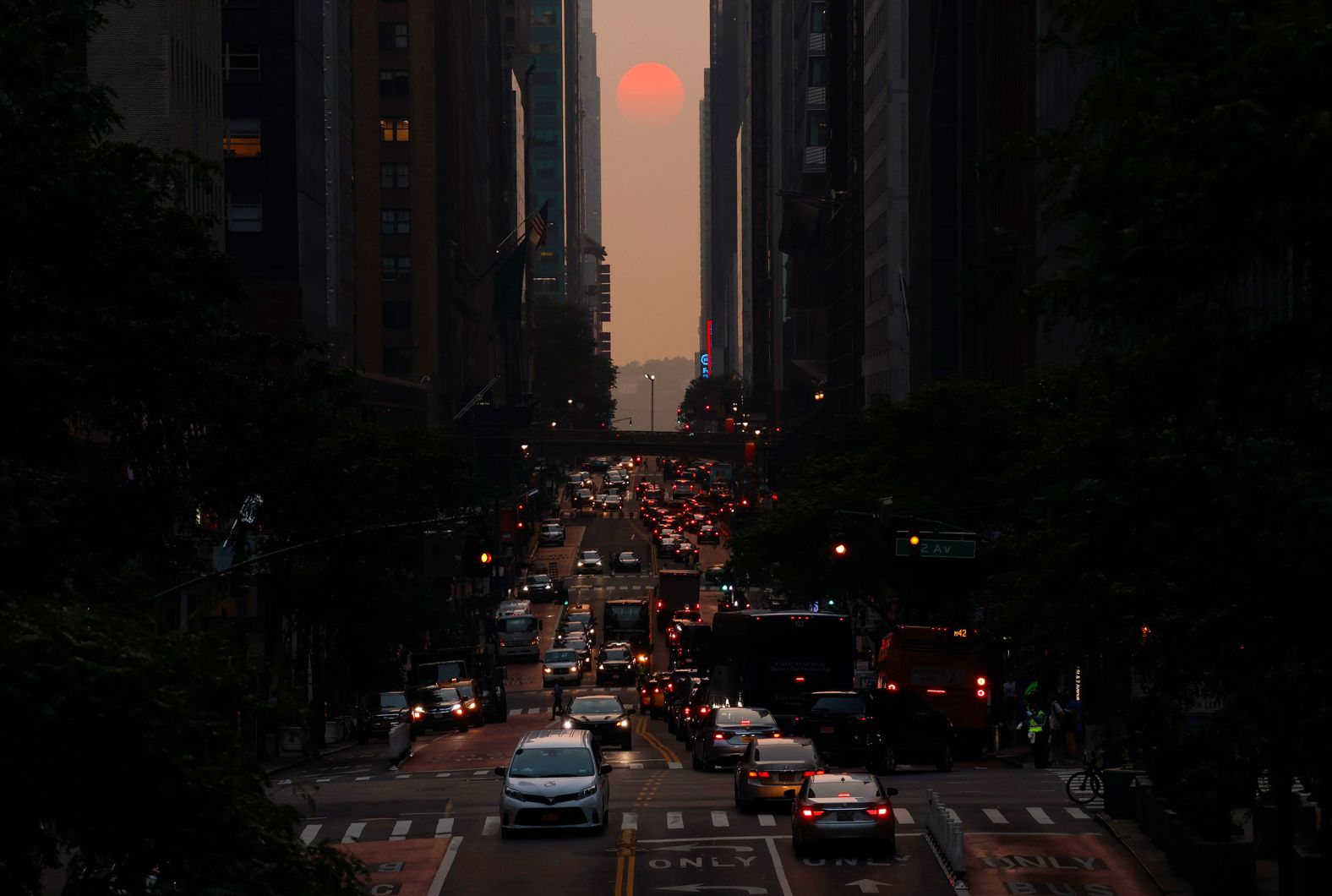 The setting sun is shrouded by smoke from Canadian wildfires in this photo taken from New York's 42nd Street on Thursday, June 29.