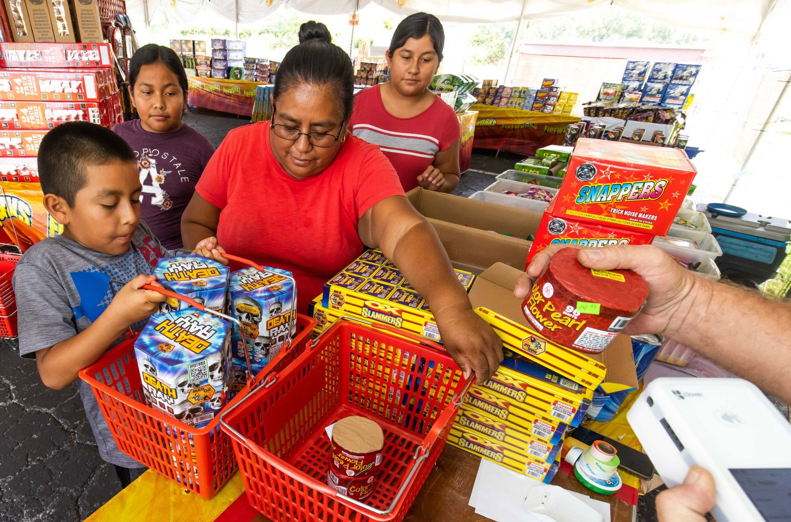 A family purchases fireworks in Ocala, Florida, on Friday.