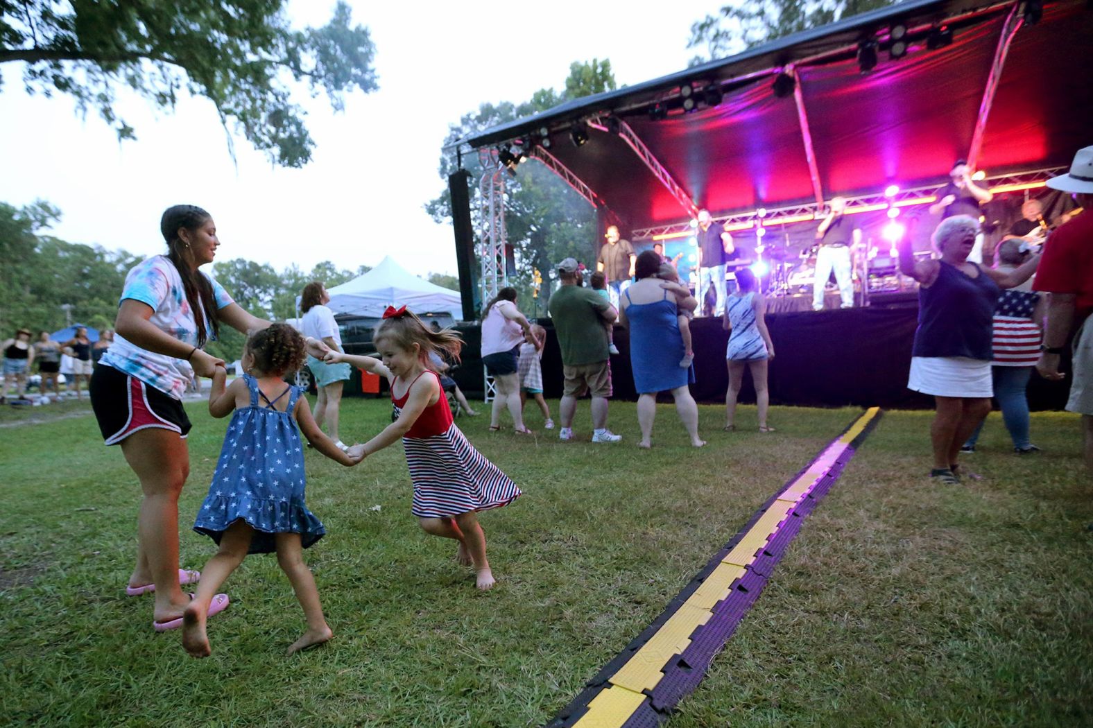 Festivalgoers dance at an Independence Day celebration in Richmond Hill, Georgia, on Saturday.