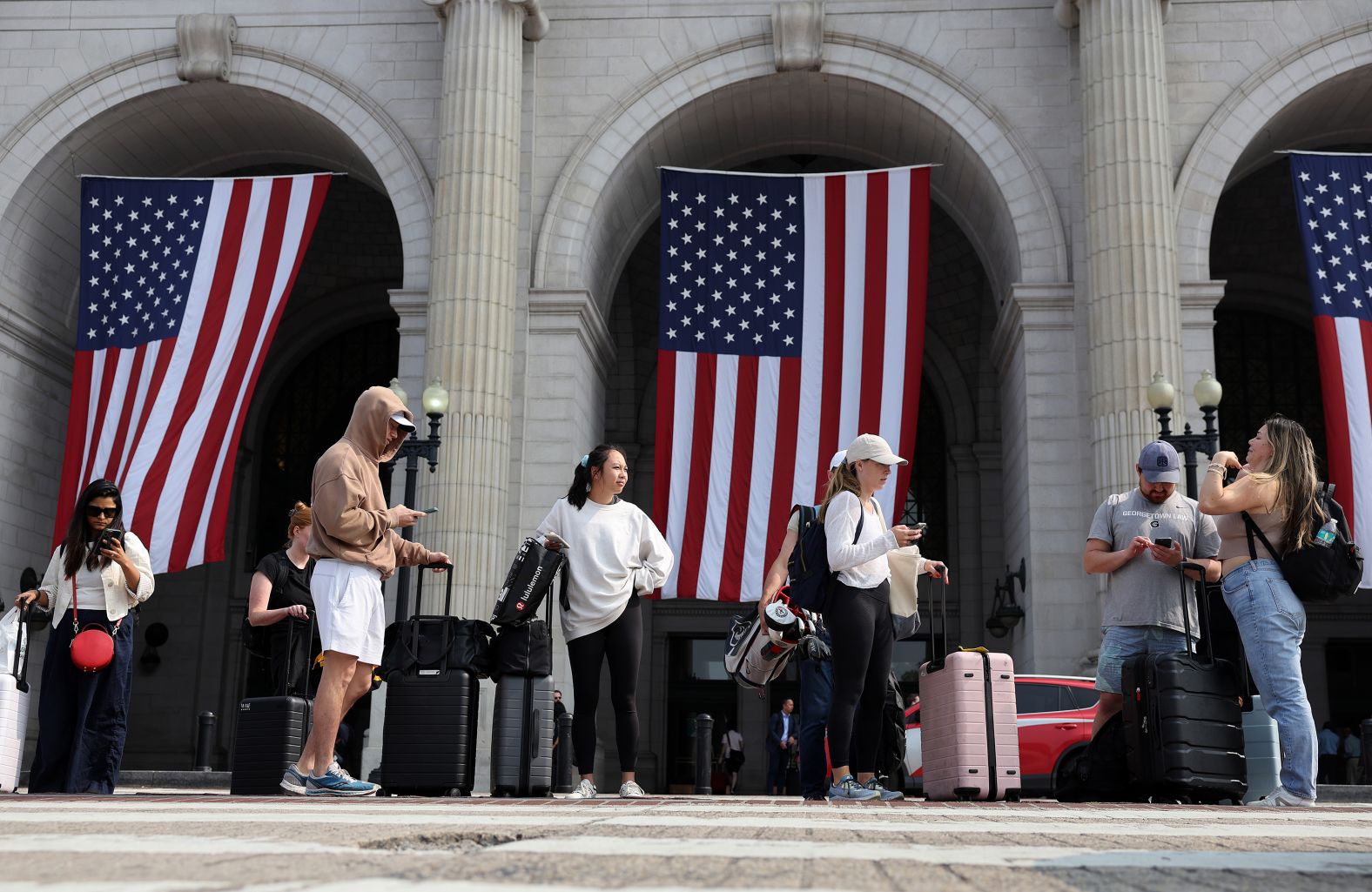 Travelers arrive at Union Station in Washington, DC, on Friday.