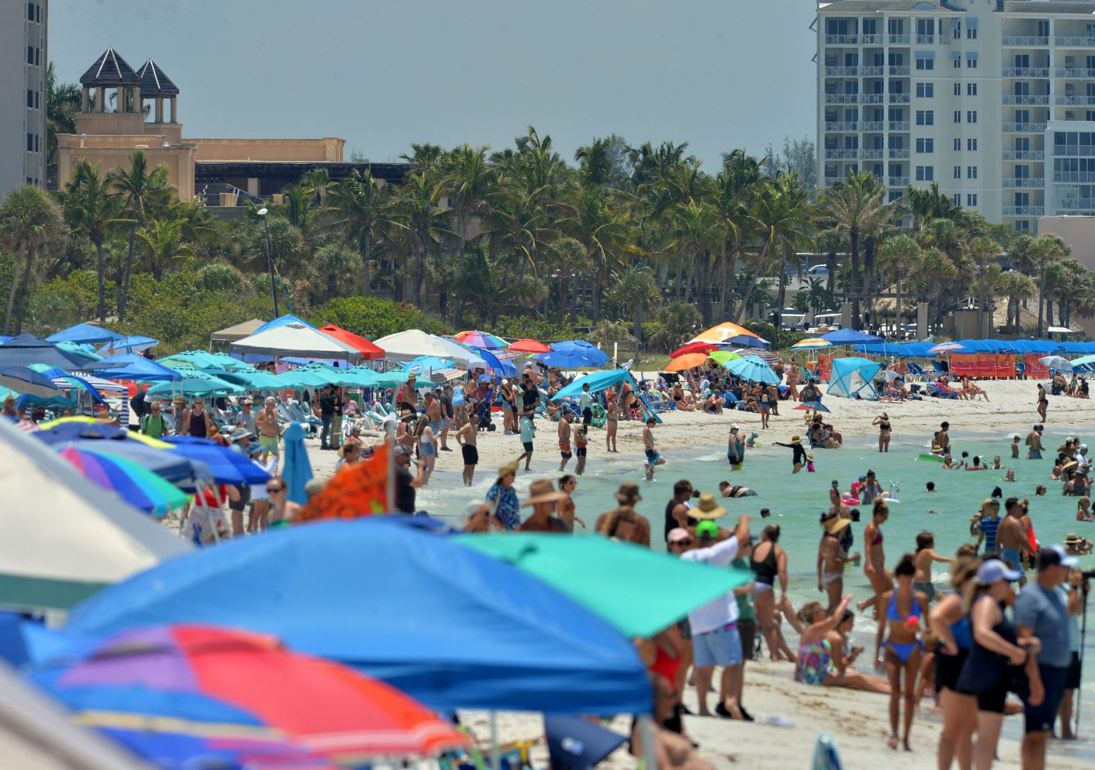 Spectators gather on Florida's Lido Beach on Saturday to watch the Sarasota Powerboat Grand Prix.