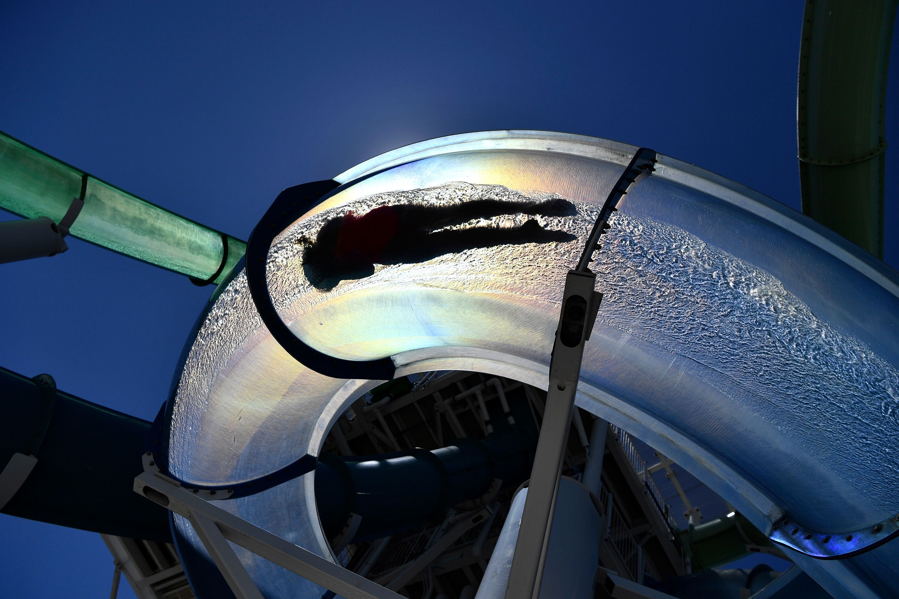 A person cools off on a water slide in Dublin, California, on Saturday.